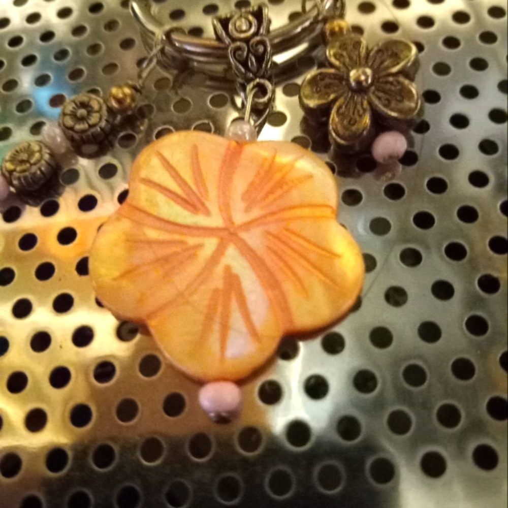 Light pink natural shell flower key chain with two hanging silver flower charms